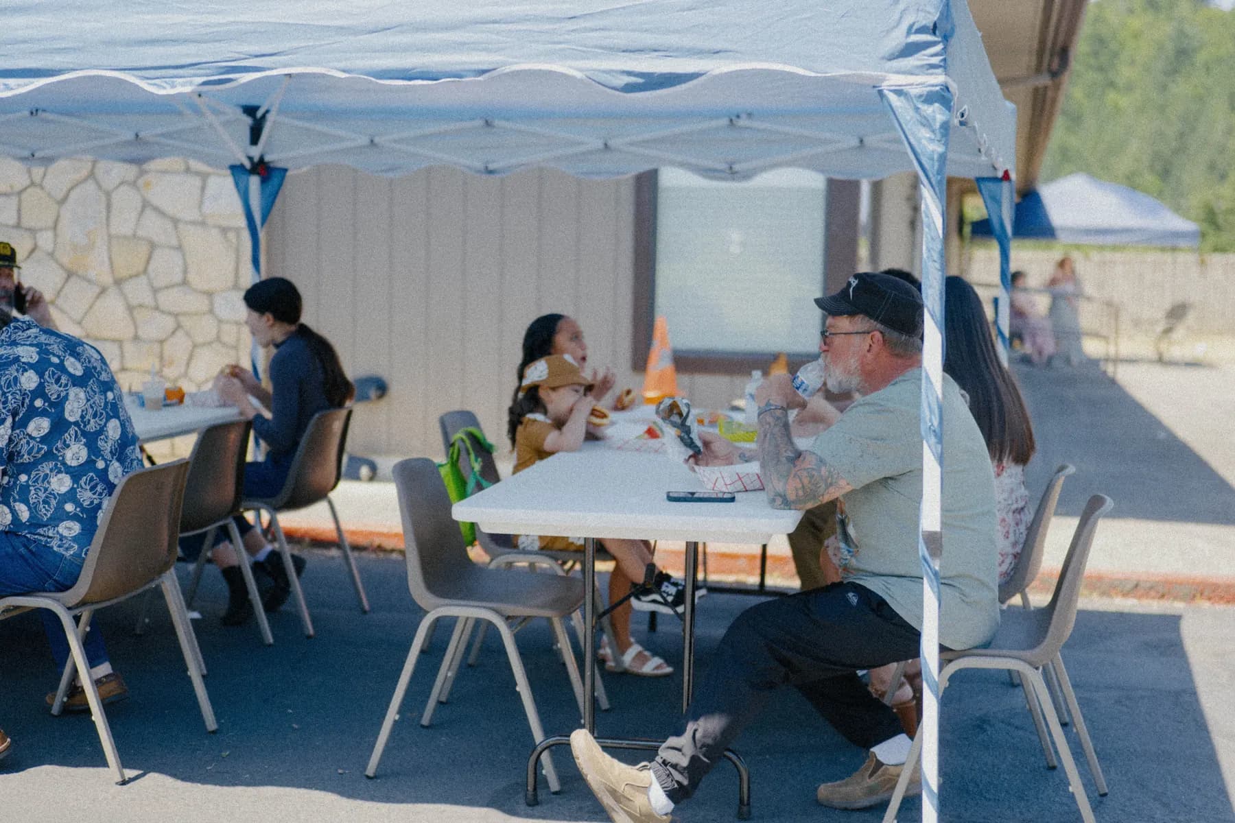 Guests gathering around the Hot Rods and Dad Bods 2026 event area, photo 21.
