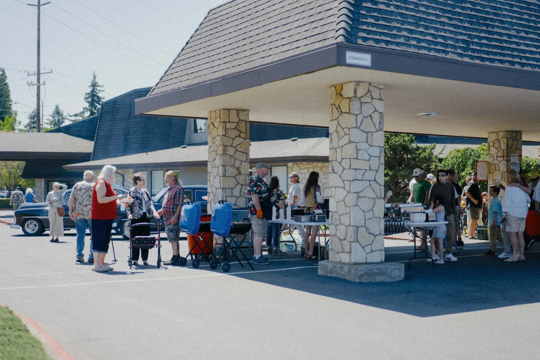 Guests gathering around the Hot Rods and Dad Bods 2026 event area, photo 22.