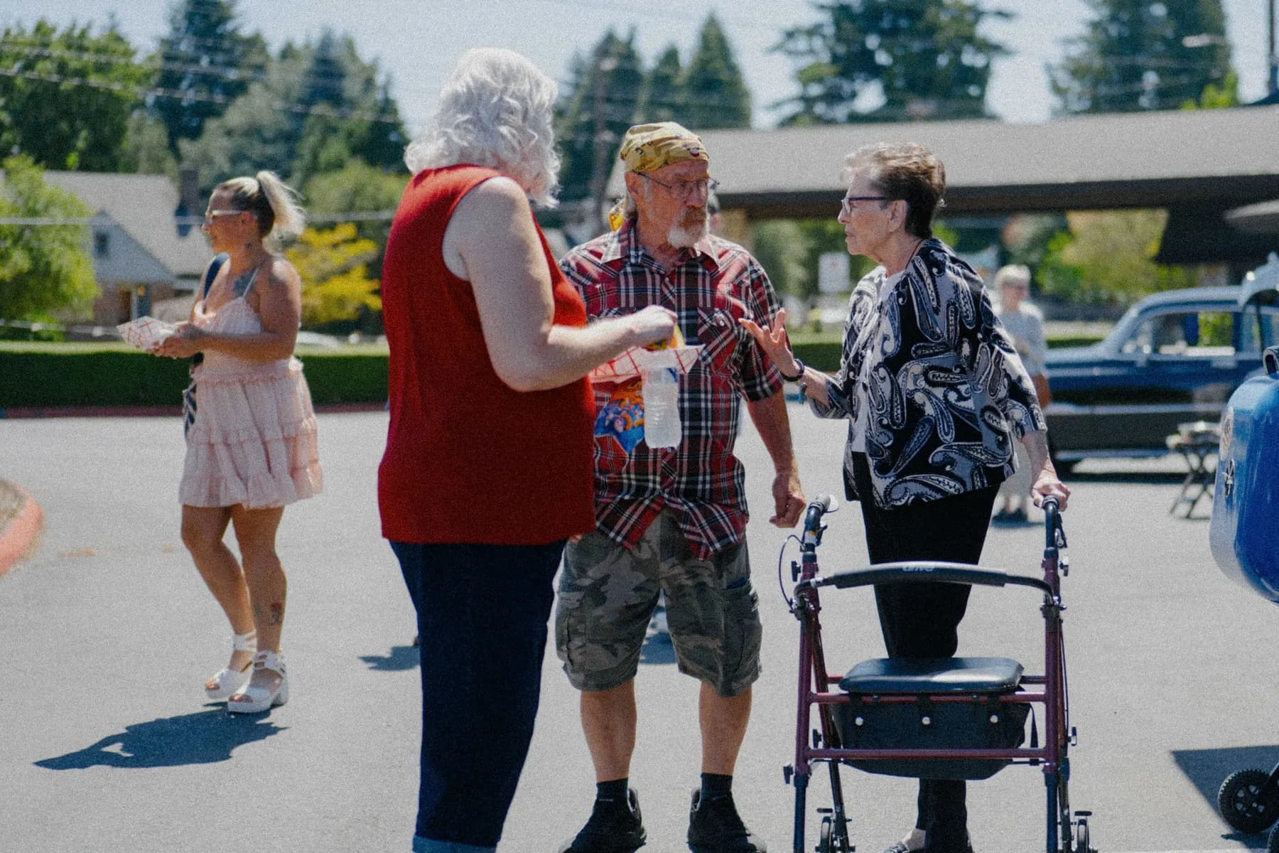 Guests gathering around the Hot Rods and Dad Bods 2026 event area, photo 24.