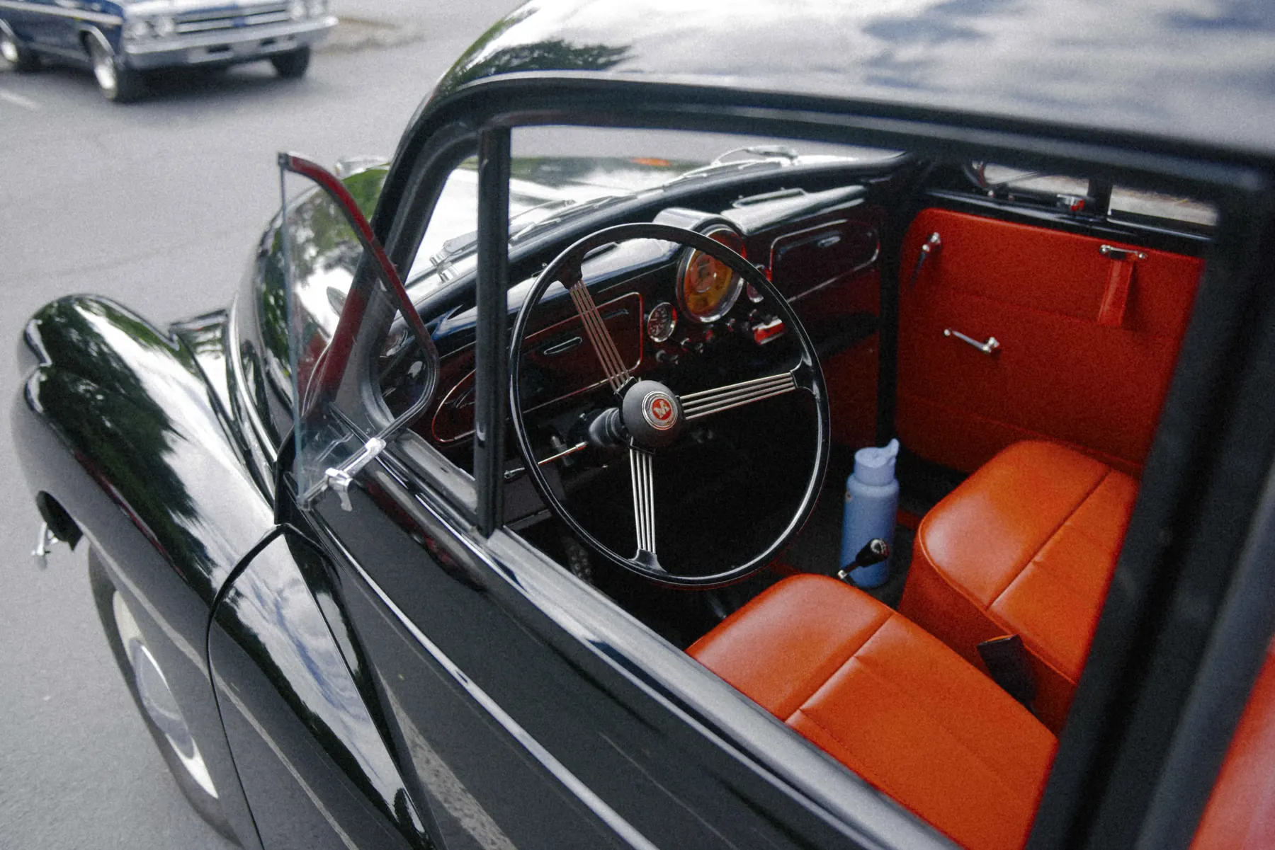 Alec Autry close-up detail from a classic car at Hot Rods and Dad Bods 2026, photo 6.