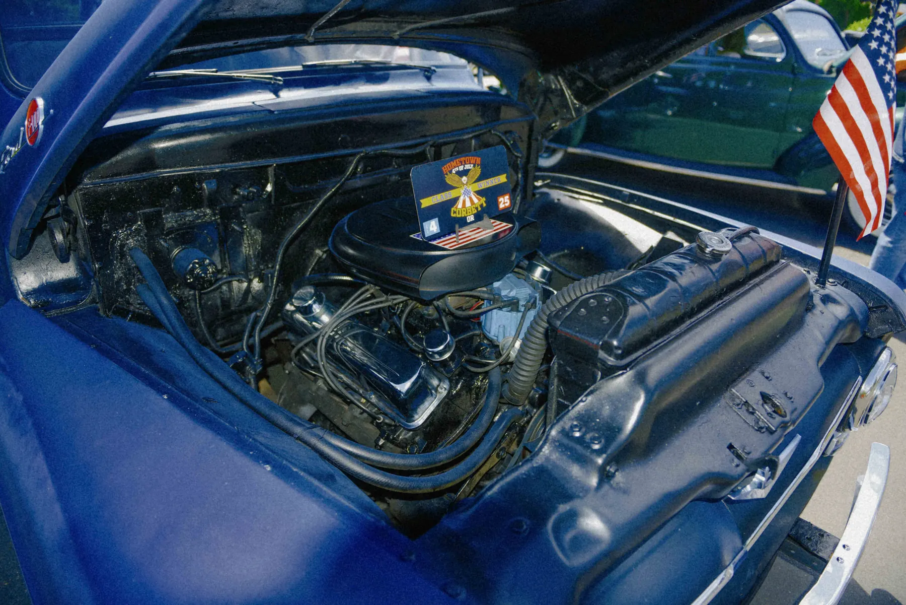 Alec Autry close-up detail from a classic car at Hot Rods and Dad Bods 2026, photo 24.